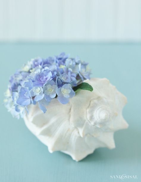 Hydrangea Shell Arrangement August Weather, Beach Centerpieces, Hydrangea Arrangement, Hydrangea Arrangements, This Heat, Arrangement Ideas, Beachy Decor, Traditional Landscape, Mermaid Party