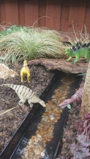 Dino Garden, Fairy Garden Design Ideas, Gravel Gardens, Kids Fairy Garden, Magical Fairy Garden, Dinosaur Garden, Playground Landscaping, Fairy Garden Ideas, Play Garden