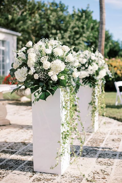 Beach Wedding Flower Centerpieces, Pillars Wedding Decor Columns, Wedding Flowers Along Aisle, Subtle Tropical Wedding, White Flowers Wedding Decor, Beach Wedding Centerpieces Flowers, Wedding Loading, Ceremony Aisle Flowers, Turks And Caicos Wedding