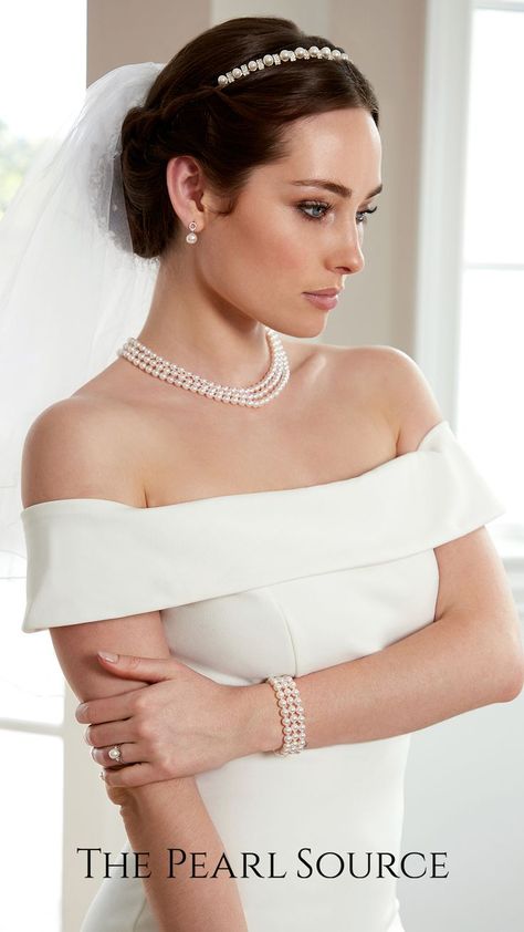 An age-old symbol of sophistication, nothing says elegance like classic white pearls. Wear a single piece or a complementary white pearl set for impeccable refinement. Brides With Necklaces, Bride With Pearls Jewelry, Wedding Dress And Pearl Necklace, Wedding Necklaces For Bride Pearl, Wedding Dress Necklaces, Bride With Pearl Necklace, Christian Wedding Jewellery, Wedding Accessories For Bride Jewelry, Wedding Dress With Pearl Necklace