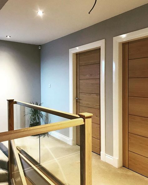 • our upstairs hallway. Oak doors with oak and glass banister. Light grey paint on the walls. Still needs a few pictures and a plant. #upstairs #hallwayideas #glassbalustrade #oak #interiordesign #homedecor White Oak Interior Doors, Upstairs Hallway Decorating, White Oak Interior, Glass Banister, Garden Staircase, Interior Doors Modern, Oak Interior Doors, House Staircase, Light Gray Paint