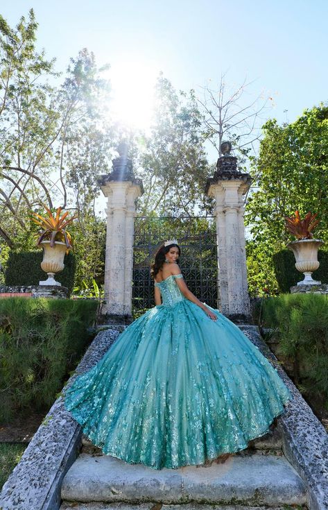 The fabric in this Princesa by Ariana Vara Quinceanera dress is Cracked Ice, Iridescent Sequin Tulle, Tulle, Stone Accents, Three-Dimensional Flowers, Pongee Lining. Detachable Off-the-Shoulder Drape, Cape, Detachable Train, Separate Full Bodice Liner, Earrings Included Teal Quince Dress, Aqua Quinceanera Dresses, Teal Quinceanera Dresses, Turquoise Quinceanera Dresses, Themed Prom Dresses, Quinceanera Dresses Blue, Disney Wedding Dresses, Fashion Illustration Sketches Dresses, Quince Dress