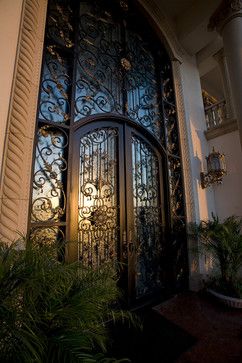 Ornate wrought iron and carved stone Mediterranean front entrance | Sweany Custom Homes       ᘡղbᘠ Wrought Iron Doors, Tuscan Decorating, Iron Door, Front Entrance, Iron Gates, Mediterranean Homes, Carved Stone, Front Entrances, Door Ideas