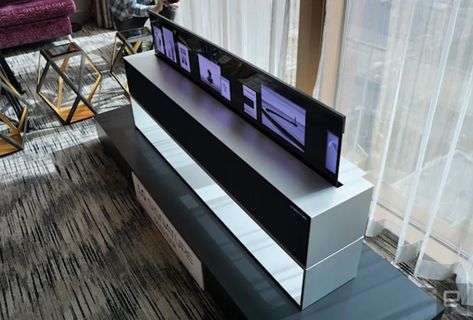 LG's rollable OLED R TV costs $100,000 in the US LG is done skirting around the price of its rollable OLED R TV. As noted by The Verge, the company’s US website now says you can buy the set for $100,000. Previously, not only did LG not list the price of the OLED R in the US, you had to call a sales representative to buy one. Now all that’s in between you and the company's futuristic TV is an “Add to Cart” button and about the cost of a down payment on a house in the Bay Area. For that amo... Rollable Tv, Lg Display, Hidden Tv, Lg Oled, Lg Tv, Home Theater Setup, Oled Tv, Audio Room, Audio Design