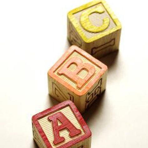 Alphabet blocks can be stacked into simple shapes. Alphabet Blocks Crafts, Block Christmas Tree, Old Fashioned Toys, Wooden Alphabet Blocks, Childrens Alphabet, Abc Blocks, Alphabet Blocks, Christmas Alphabet, Wooden Alphabet