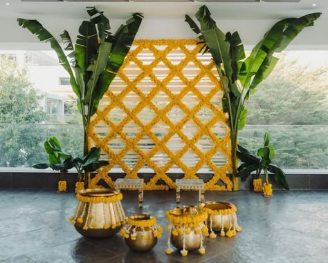 We’re Obsessed With These Sunshine-Themed Haldi Decor Ideas | WedMeGood Indian Backdrop Ideas For Pooja, Backdrop Floral Backgrounds, Marigold Backdrop Decoration, Low Budget Stage Decoration, Low Budget Haldi Decoration, Ganpati Backdrop Ideas Diy, Marigold Flower Decoration Backdrop, Decoration For Haldi Ceremony At Home, Ganpati Decoration Theme At Home Simple