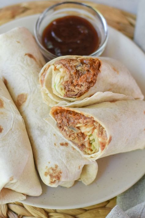 Repurpose leftovers into these tasty pulled pork wraps! Tangy pulled pork and crispy coleslaw have new life in this handheld favorite! Pulled Pork Wraps, Pulled Pork Wrap, Pulled Pork Salad, Pork Fajitas, Repurpose Leftovers, Hawaiian Pork, Leftover Pulled Pork, Pork Wraps, Pork Lettuce Wraps