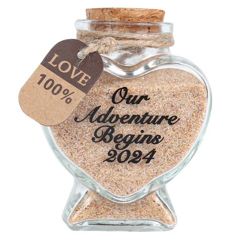 PRICES MAY VARY. HONEYMOON GIFTS: Newlyweds travel sweet memories decorative bottle that can hold sand, soil, leaves...and best memories. NEWLYWED GIFT: Giving you and your lover most loving memories again and again; This is the perfect wedding for couples, which will make you think of your love in the years after your honeymoon. HANDMADE JARS: Each "Our Adventure Begins 2024" LOGO is hand-printed by workers, and the text will not fall off or fade.Love heart shape glass bottle,made of transparen Honeymoon Jar, Sand Keepsake, Gift Ideas For Bride, Our Adventure Begins, Travel Gift Ideas, Engagement Gifts Newly Engaged, Gift For Newlyweds, Honeymoon Gifts, Adventure Begins