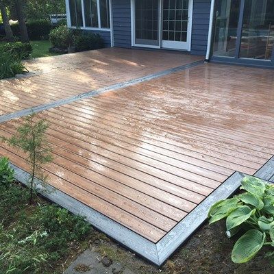 1300 sq ft  Trex transcends Deck built in Setauket Ground Level Trex Deck, Trex Patio Ideas, Low Deck Designs, Trex Patio, Decking Designs, Landscaping Around Deck, Small Backyard Decks, Ground Level Deck, Patio Areas