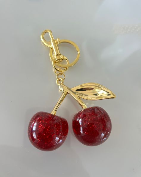 Cherry 🍒 bag charms are now available to purchase such a cute accessory for your bags, purses 👜 or as a key ring 🫶🏻 New to our store but the Cherry Bag Charm are included in our SUMMER SALE only £9!! #cherry #cherrytop #cherrycharm #cherries #cherryfashion #cherryjewelry #cherryjewellery #cherrykeychain #goldjewellery #goldjewelry #waterproofjewelry #goldrings #gold #ontrendfashion #ukfashionblogger #ukfashion #ukinfluencer Cherry Bag, Cherry Charm, Paper Bag Design, Wishlist 2024, Bag Charms, Metal Keychain, Waterproof Jewelry, Cute Charms, Bag Design