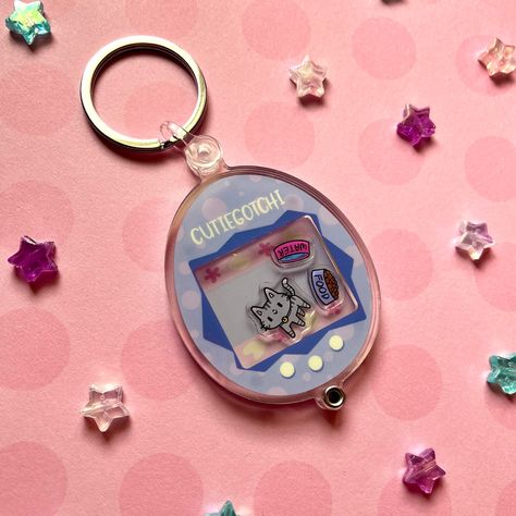 The Cutiegotchi! An openable and customizable shaker keychain 💕🐱 and mini charm packs too! . . . . . #customkeychain #openablekeychain #shakercharm #carlovers #cutiegotchi #pinkstuff #nostalgicart #cutecats Cat Merch, Shaker Keychain, Charm Packs, Kawaii Things, Nostalgic Art, Cute Kitty, Mini Charm, Charm Pack, Love Stickers