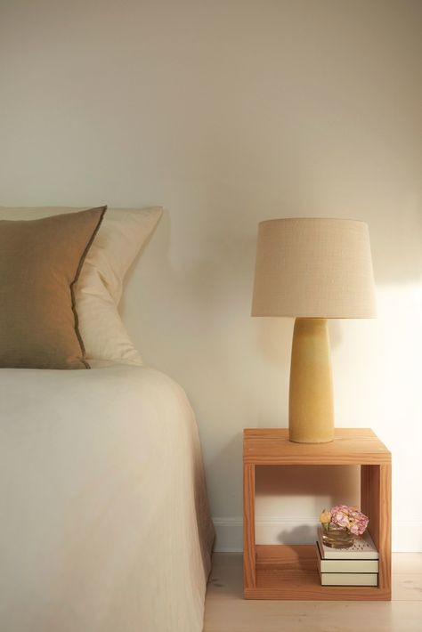 An antique Danish lamp by the ceramist Palshus (with a new linen shade—perhaps the easiest way to update an antique lighting fixture) sits atop a more modern bedside table made by Steffan. Everything in the room is intentional, useful, and uncluttered: In the bedside table sits a small box with a silk eye mask and essential oils, the book Feiffer is currently reading, and a garden flower. Copenhagen Apartment, Townhouse Apartments, Antique Light Fixtures, Modern Bedside Table, Apartment Architecture, Apartment Renovation, Marcel Breuer, Copenhagen Style, Antique Lighting