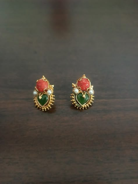 Coral and jade earrings Pagadam Ear Studs, Modern Gold Jewelry Indian, Antique Gold Earrings Simple, Coral Studs In Gold, Coral Earrings Gold Indian, Coral Jewelry Indian Gold, Gold Studs Earrings Indian, Small Earrings Gold, Gold Earrings Indian