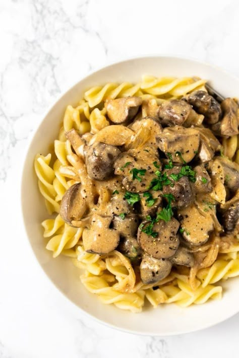 Creamy vegetarian mushroom stroganoff. Quick to make and easy to prepare this comforting vegetarian dish can be ready to eat in about 30 minutes and served with anything from pasta to potatoes. Mushroom Stroganoff Vegetarian, Stroganoff Vegetarian, Mushrooms Pasta, Recipes Vegetarian Dinner, Vegetarian Comfort Food, Mushroom Stroganoff, Dinner Recipes Vegetarian, Canned Mushrooms, Vegetarian Dinner Recipes