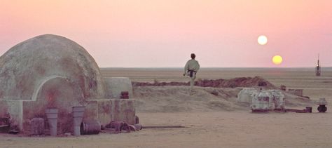 In the opening scenes of Star Wars we see Luke Skywalker looking out into the vast desert of the alien planet Tatooine, while two moons orbit in the distance. I always thought this scene was a great way to make us, the viewer, feel a real sense of alienation through the eyes of the main character. Whenever I think of Star Wars lots of iconic scenes jump to mind, almost as if they were on a highlight reel or something, well, if that were so, this would definitely be on that very highlight reel. Binary Sunset, Sunset Gif, Michael Cimino, Star Wars Planets, Star Wars Episode Iv, Star Wars 1977, Episode Vii, Star Wars Disney, Movie Shots