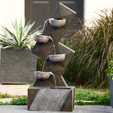 Fixed to an angular pillar, this lovely cascading fountain boasts four intricately designed bowls in a rustic metal finish. Water gently pours into each pool, providing a soothing sound that's enjoyable for outdoor areas. Outdoor Fountain Ideas, Mall Exterior, Backyard Waterfalls, Fountain Wall, Patio Fountain, Water Fountain Design, Backyard Patio Deck, Front Yard Decor, Indoor Water Features