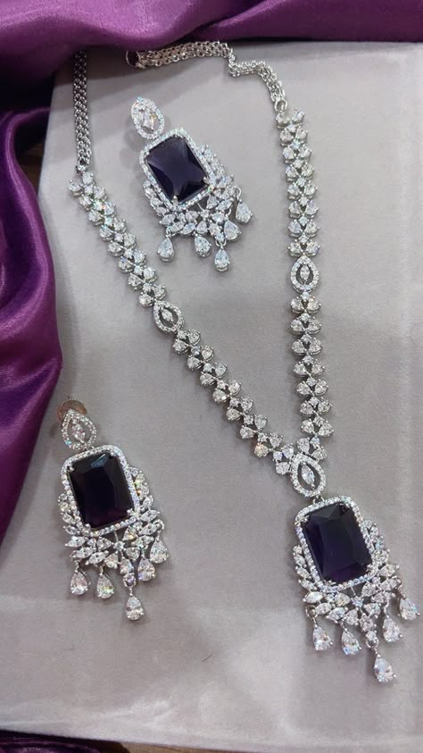 Gorgeous fine quality imitation jewellery  CZ Purple with CZ diamonds studded necklace with white gold rhodium plating and matching Earrings Item contains: Necklace and earrings AAA quality cubic zirconia used. Highest quality and craftsmanship Necklace Fitting is adjustable Earrings Closure: Pushback Necklace Closure: chain with Hook Details-  -Handmade item -Delivery from a small business in India -Materials: white rhodium, stones, cz, zircon, American diamond -Jewellery type: Earrings, Neckla Necklace Closure, Neck Pieces Jewelry, American Diamond Jewellery, Fancy Jewellery Designs, Diamond Necklace Designs, Stone Jewellery, Zirconia Necklace, Diamond Necklace Set, Studded Necklace