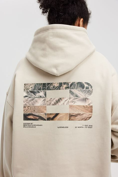 Introducing the FW23 LOGO Textures Graphics Hoodie, where nature meets urban style. On the back, a monumental logo merges a medley of natural textures, including mountains, rivers, deserts, etc. This intricate design contrasts with the elegantly subtle logo on the left chest. Crafted in a premium heavyweight fabric, this hoodie offers both style and substance, finished with a slightly oversized silhouette for a contemporary touch. Natural texture-infused back logo Subtle left chest LOGO Premium Back Graphic Hoodie, Best Hoodie Design, Man Pattern Design, Trending Hoodie Designs, Hoodie Design Graphic, Graphic Design Sweatshirt, Merchandise Design Graphics, Hoodie Merch Design, Graphic Design For Hoodies