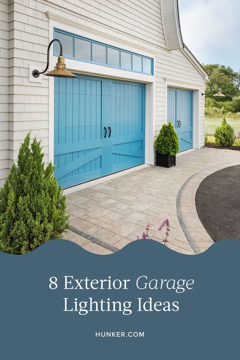 Quality outdoor lighting can improve safety and enhance how your abode looks to others. So here are eight exterior garage lighting ideas to help make your carport glow. #hunkerhome #exteriorlighting #garage #garagelighting #exteriorlightingideas Lights By Garage Door, Garage Exterior Lighting, Garage Lighting Exterior, Garage Coach Light, Exterior Garage Lighting, Carport Lighting Ideas, Garage Exterior Lights, Garage Door Lantern Lights, Carport Lighting