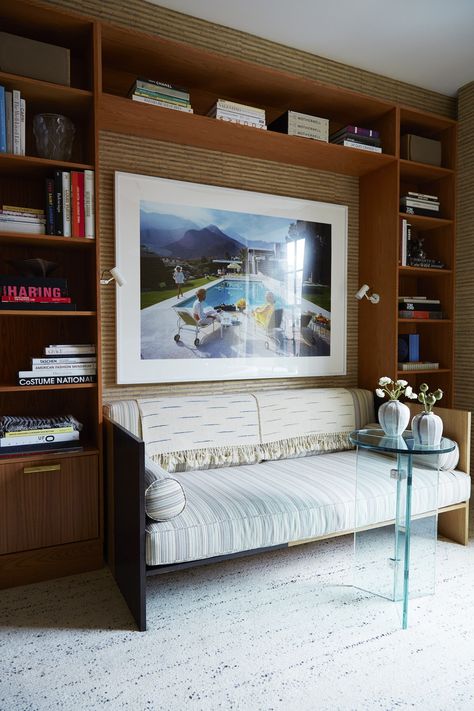 A Slim Aarons photograph backs a custom daybed upholstered in this study | archdigest.com Custom Daybed, Office With Daybed, Daybed Upholstered, Study Wallpaper, Kardashian Home, Downstairs Loo, White Interiors, Manhattan Apartment, American Interior