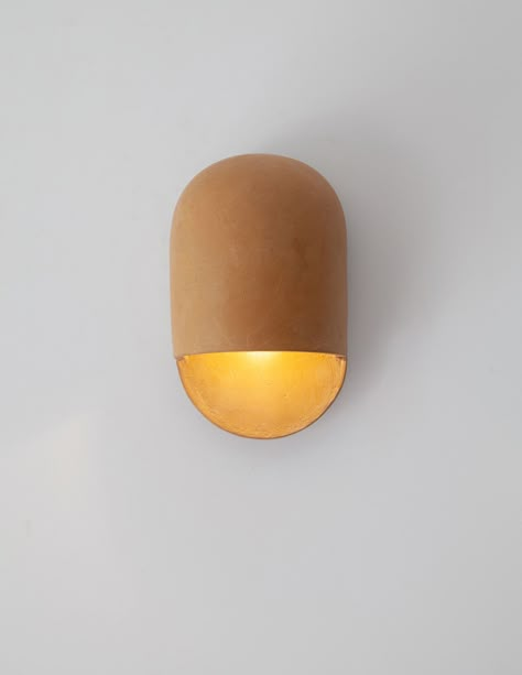 The new Tera Sconce is an extension of Ceramicah's Tera Collection, complementing the studio's already popular Tera Lamp. Ceramic Wall Lamps Handmade, Ceramic Light Fixture, Organic Natural Home, Paper Mache Wall Art, Living Room Sconces, Signature Wall, Pottery Lighting, Sculptural Lighting, Lime Plaster