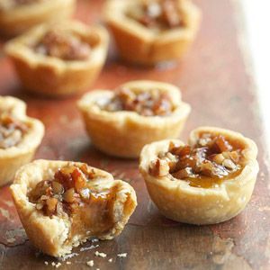 Pumpkin-Pecan Tassies These tiny treats contain all the tantalizing flavors of pumpkin and pecan pies. Pecan Tassies, Mini Pecan Pies, Pecan Pies, Holiday Platters, Dessert Bites, Tiny Treats, Pumpkin Spice Syrup, Pumpkin Pecan, Mini Pies