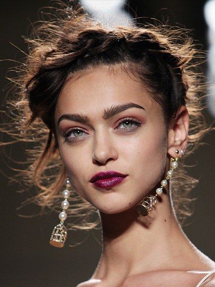 The inspiration behind the look at the Nicole Miller show may have been the eighteenth century, but the deep violet-fuchsia lip color was full-on 2014. (It's undeniably reminiscent of Pantone's color of the year, radiant orchid.) To get it, makeup artist James Kaliardos lined the models' lips with M.A.C. Lip Pencil in Vino, then swiped on M.A.C. Lipstick in Violetta, a bold purple. FOR A SIMILAR LOOK, TRY: 1. Iman Luxury Moisturizing Lipstick in Flirtatious 2. Avon Ultra Color Bold Lipstick i... Casual Lipstick Color, Purple Lipstick Looks, Purple Lipstick Makeup, Violet Lipstick, Lips Shape, The Flaming Lips, Flaming Lips, Bright Lipstick, Bold Lipstick