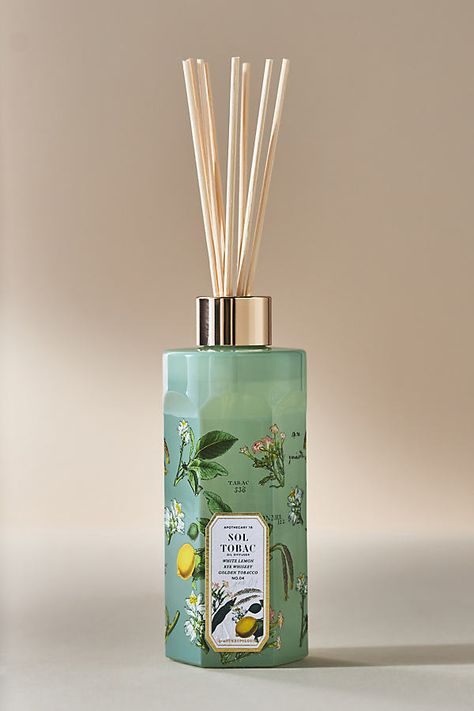 Adorned with beautiful botanicals, this only-at-Anthro fragrance oil lends everyday elegance to any living space – and is perfectly giftable for the scent-obsessed. Sol Tobac (Floral Gourmand) : An enticing aroma of sun-kissed bergamot and a soft hint of white flowers gently dances atop a warm base of tobacco and vanilla. | Apothecary 18 Floral Sol Tobac Reed Diffuser by Apothecary 18 by Anthropologie in Green Anthropologie Scent, Aesthetic Reed Diffuser, Oil Reed Diffuser, Diffuser Reed, Unique Reed Diffuser, Present For Her, Dorm Inspo, Everyday Elegance, Gift Ideas For Her