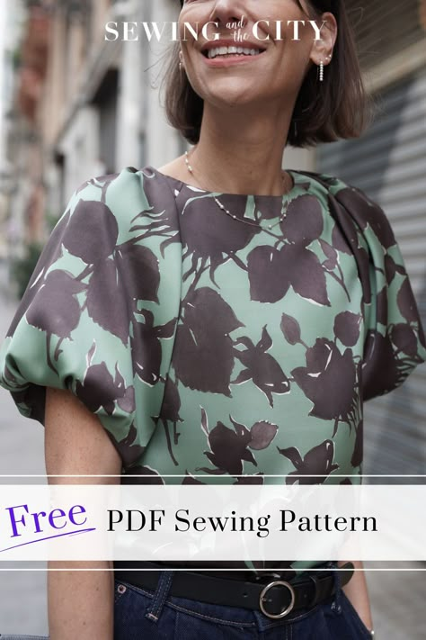 Get this Free PDF Sewing Pattern when you subscribe to my weekly newsletter! The Manhattan PDF Sewing Pattern is an easy fitting a-line pullover top and dress featuring pleated raglan sleeves with fullness gathered into an inner lining, a neck facing, and keyhole button closure at back with optional bow trim. Designed for light to medium weight wovens, the Manhattan is a stylish addition to your wardrobe! Free Pdf Sewing Patterns, Blouse Dress, Pdf Sewing Patterns, Sewing Patterns Free, Manhattan, Raglan Sleeve, Pdf Pattern, Free Pattern, Sewing Patterns