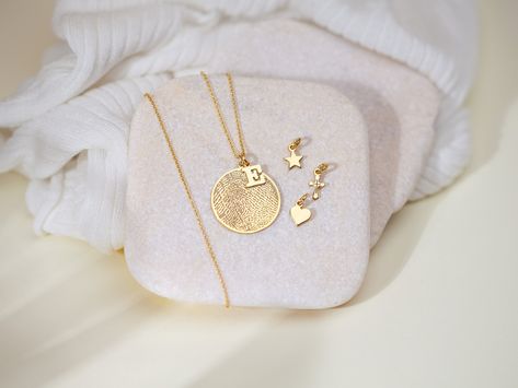 "Whoever is special for you, you can wear her/his fingerprint on your neck. If you have a loss that you miss very much, you can keep her/his memory alive forever. Or if you want, you can wear your baby's footprint as a necklace on your neck.  This unique and meaningful jewelery can be combined with daily clothes and suits. If you want to buy this jewelery as a gift for someone you love, you are definetely make the right choice. This design is especially preferred as a birthday gift, anniversary gift, graduation gift or just a hearthwarming gift. After completing your order, please send us the fingerprint image via message. All my designs are custom made with love! ♡ Dimensions: diameter circle 1.07\" Material: high quality solid 925 sterling silver with 14k gold filled All of the products Sterling Silver Necklace Dainty, Keepsake Necklace, Fingerprint Necklace, Baby Fruit, Baby Mom, Daily Clothes, Baby Footprints, Birth Gift, Long Chain Necklace