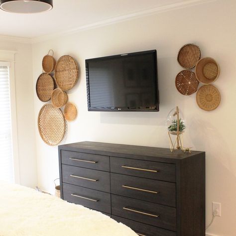 Wall baskets on tv wall. Alabaster White Wall and trim. Baskets Around Tv On Wall, Baskets Around Tv, Basket Wall Above Tv, Wall Baskets Around Tv, Basket And Picture Wall, Basket Wall Around Tv, White Wall And Trim, Basket Wall Bedroom, Boho Tv Wall Decor