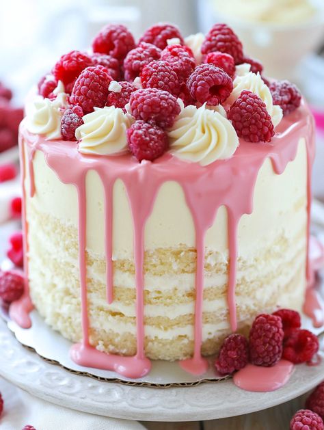 Elegant White Chocolate Raspberry Cake 🍰🍓🍫  🍰 𝗜𝗻𝗴𝗿𝗲𝗱𝗶𝗲𝗻𝘁𝘀 🍫  For the Cake: 2 1/2 cups all-purpose flour 2 1/2 teaspoons baking powder 1/2 teaspoon salt 🧂 1 cup unsalted butter, softened 🧈 2 cups granulated sugar 🍚 4 large eggs 🥚 2 teaspoons vanilla extract 🍨 1 cup whole milk 🥛 1/2 cup sour cream 🥄 1/2 cup white chocolate chips, melted and cooled 🍫 1 cup fresh raspberries 🍓 For the White Chocolate Frosting:  1 cup unsalted butter, softened 🧈 4 cups powdered sugar 🍬 Raspberry Cake Ideas, White Chocolate Raspberry Wedding Cake, Raspberry White Chocolate Cake, White Chocolate Raspberry Cake, White Chocolate Frosting, Birthday Cake Decorating Ideas, Chocolate Raspberry Cake, Raspberry Recipes, Cupcakes Decorados