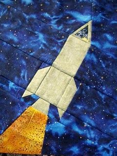 My own rocket design for the long distance quilting bee. Space Baby Quilt, Outer Space Quilt, Airplane Quilt, Kid Quilts Patterns, Space Quilt, Paper Pieced Quilt Patterns, Machine Quilting Designs, Paper Pieced Quilt, Childrens Quilts