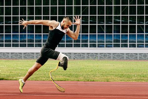 A wide shot of a Paralympic male athlete running down the track. Runner Athlete, Physically Disabled, Adaptive Sports, Shot Put, Start Running, Physical Disabilities, Paralympic Games, Winter Event, Aging In Place