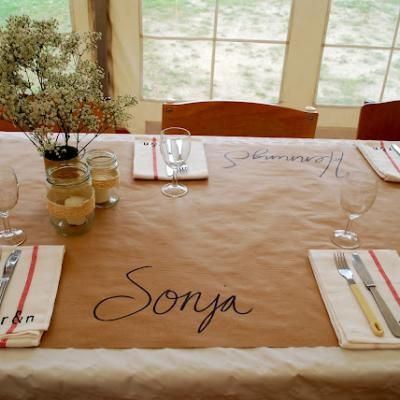 Inexpensive, fun table idea. Use butcher paper (or brown mailing paper) as a "tablecloth".  Write guests names at each place. Paper Tablecloth, Dinner Party Table, Paper Table, Party Table Cloth, Thanksgiving Table Decorations, Butcher Paper, Festival Wedding, Diy Wedding Decorations, Thanksgiving Table