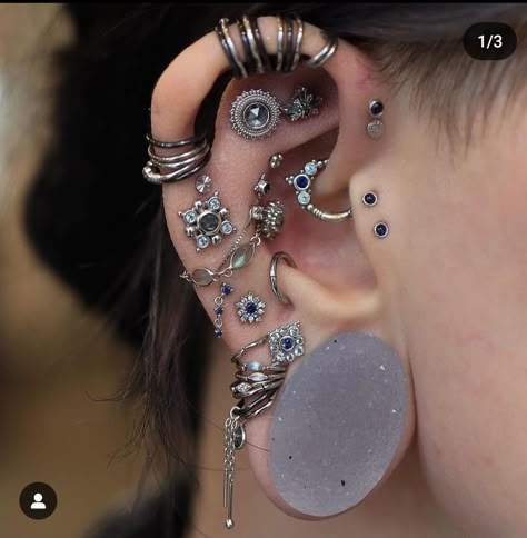 Unique Dermal Piercing, Double Stretched Lobes, 1 Inch Stretched Ears, Ear Piercing Layout Ideas, Gauged Ears With Piercings, Face Piercing Set Up, Both Ears Pierced Ideas, Ear Piercing Set Up, Ear Curation Silver