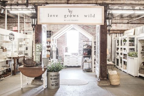 Home and lifestyle blogger Liz Fourez takes you on a tour of her retail shop in Indiana with her favorite home decor pieces and the unique displays she built to create a destination to shop in. Country Boutique Decor, Owning A Retail Store, Retail Accent Wall, Farmhouse Retail Store, Industrial Retail Design, Liz Fourez, Wood Pillars, Antique Faucet, Antique French Doors