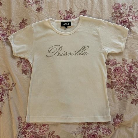 “priscilla” x a24 rhinestoned babydoll tee 

most... - Depop Babydoll Tee Outfit, Oddli Custom Baby Tee, Coquette Babydoll Top, 2000s Babydoll Top, Babydoll Tee Y2k, Rhinestone Tees, Style Board, Infant Tees, Baby Dolls