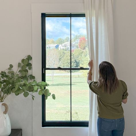 While building our home, we knew the windows and doors would be key focal points in the design. The black frames provide a striking contrast against the white exterior, making them stand out beautifully. The craftsmanship from Pella exceeded our expectations, and we couldn’t be happier with our decision! #pellawindows #pellainspired @pellawindows #modernfarmhouse #modernfarmhousestyle #modernfarmhouseexterior #blackwindows #blackwindowframes #homedesignideas #homebuild #customhomedesign #p... Window Casing Black Windows, White Trim Bathroom, Window Grids Styles, Black Vs White Windows, Black Grid Windows, Modern Farmhouse Windows, Black Interior Windows, Black Trim Windows, Grid Windows