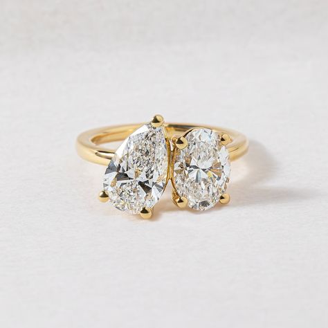 5 unique style trends our clients are choosing to make their rings stand out a little extra✨ 1. UNIQUE SIDE STONES & CUTS Unique cuts such as trapezoid, half-moon, trillian, and baguette cuts can complement and enhance the centre stone and brings more sparkle and dimension. Featured 1.50ct Hexagon cut with Kite sides stones | Bespoke 2. EAST WEST SET ELONGATED STONES Setting elongated stones like emerald, marquise, or oval cuts horizontally (east-west) across the band rather than the trad... Double Stone Engagement Ring, Two Stone Ring, Oval Moissanite Ring, Pear Cut Ring, Gold Anniversary Rings, Oval Diamond Ring, Stone Wedding, Simulated Diamond Rings, Cz Rings Engagement