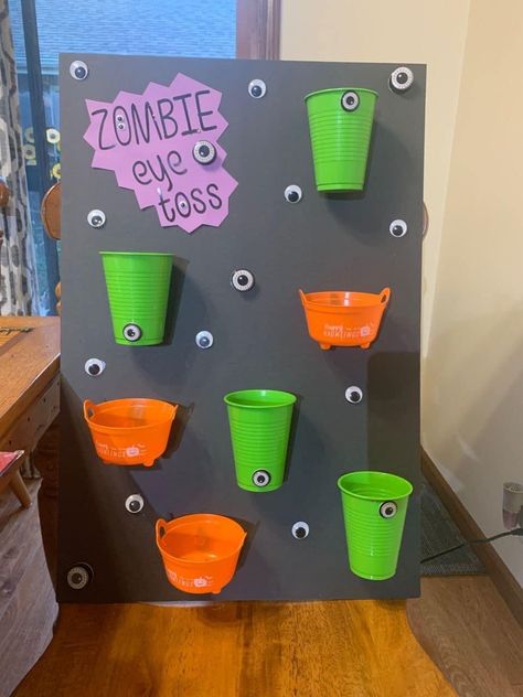 Halloween Party Ideas Elementary School, Zombie Birthday Party Games, Halloween Town Birthday Party, Halloween School Event Ideas, Zombie Eyeball Toss Game, Fall Classroom Party Ideas Kindergarten, Halloween Classroom Party Decorations, Halloween 2nd Grade Party, Homeroom Mom Halloween Party