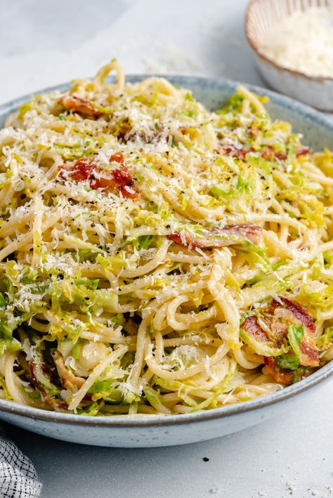 Incredible bacon parmesan brussels sprouts spaghetti packed with flavor and made with super simple ingredients. This easy brussels sprouts spaghetti recipe comes together in just 30 minutes for a delicious, protein-packed dinner the whole family will love! #brusselssprouts #spaghetti #pasta #healthydinner Brussel Sprout Pasta, Turkey Pesto Meatballs, Fall Pasta Dishes, Parmesan Brussels Sprouts, Fall Pasta, Bacon Brussel Sprouts, Ambitious Kitchen, Spaghetti Recipe, Sprouts With Bacon