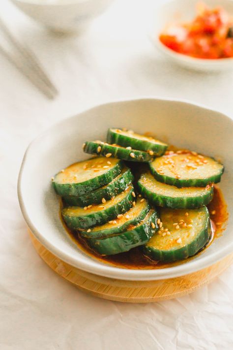 Sliced cucumbers in chili oil in a white bowl. Korean Pickles, Spicy Korean Cucumber, Korean Cucumber Salad, Korean Cucumber, Spicy Cucumber Salad, Bulgogi Beef, Spicy Korean, Persian Cucumber, Spicy Pork