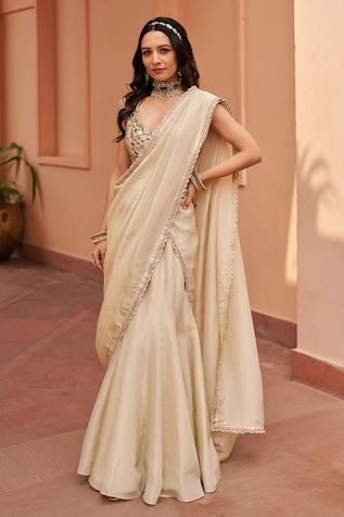 Buy White Satin Modal Embellished Threads V Floral Embroidered Draped Saree Gown For Women by GEE SIN by Geetanjali Singh Online at Aza Fashions. Tissue Lehenga, V Neck Lehenga, Lehenga Sari, Ivory Bridesmaid Dresses, Mirror Work Lehenga, Gaurav Gupta, Simple Lehenga, Navratri Dress, Bridesmaid Saree