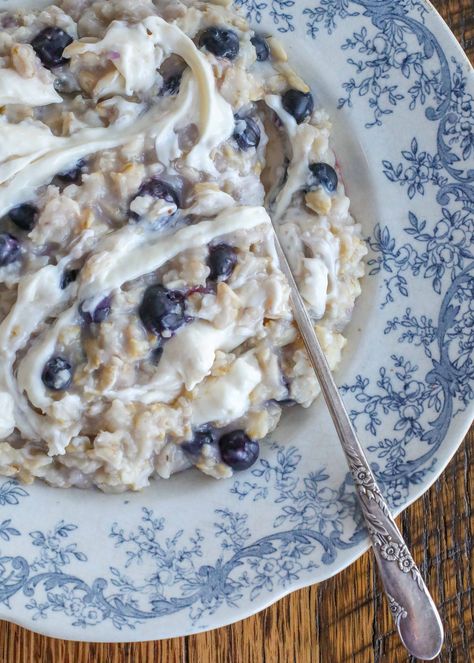 Creamy oats, fresh blueberries, and a swirl of lightly sweetened “cheesecake” adds up to a hot breakfast bowl that will leave everyone full and happy. The sweet and slightly tangy cream cheese is a great balance to the hearty oats and warm berries that burst in each bite. My friend Faith mentioned her Blueberry Oatmeal… Baked Cheesecake Oats With Blueberries, Cheesecake Oatmeal, Vegan Blueberry Oatmeal Bake, Cheese Oatmeal, Vegan Blueberry Baked Oats, Blueberry Almond Oatmeal, Baked Oatmeal Recipes Healthy, Banana Oatmeal Recipe, Creamy Oats