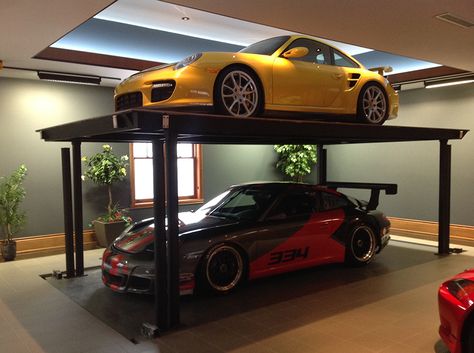 Add an extra Porsche with a custom residential car lift by American Custom Lifts, designers of the first and only American-made single post car lift for storing two vehicles in the parking space of one. Garage With Car Lift, Single Post Car Lift, Home Car Lift, Garage Car Lift, Buying Car, Prefab Garages, Garage Solutions, Garage Lift, Cool Garages