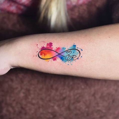 29 Superb Infinity Tattoo Designs Watercolor Infinity Heart Tattoo, Infinity Tattoo Colorful, Infinity Number Tattoo, Neurodivergent Infinity Tattoo, Infinity Color Tattoo, Infinity Watercolor Tattoo, Infinite Tattoo Design, Infinity Tattoo Color, Infinity Tattoo Designs For Couples