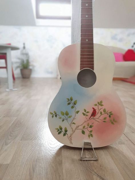 My dad gifted me a guitar many many years ago, and I kept it as a memory after he passed away. I’ve never had musical skills, so using the instrument for playing has never been a thing for me. Painting it was the right thing to do since I wanted to have it on my sight, as a memory of my father. Here’s how this DIY project went. What You Need for This ProjectThis guitar has been made over 30 years ago, in a factory that was pretty known back in time. The instrument has been preserved… Paint Guitar Diy, Paint Guitar, Old Guitar, Happy Signs, Diy Guitar, Guitar Diy, Greek Blue, Ombre Background, Guitar Painting