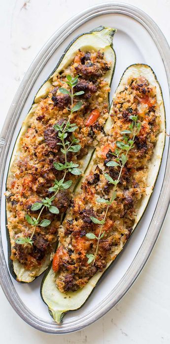 Stuffed Zucchini is a great way to use up those extra large zucchini from the garden. Stuff with Italian sausage, onions, garlic, tomato, and fresh breadcrumbs, and bake! Zucchini Boats Italian, Large Zucchini Recipes, Chicken Stuffed Zucchini Boats, Chicken Stuffed Zucchini, Zucchini Sausage, Stuffed Veggies, Bake Dinner, Italian Zucchini, Large Zucchini