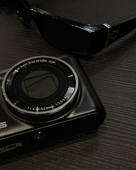 digital camera, sunglasses, dark aesthetic, minimal Dark Sleek Aesthetic, Dark Minimalism Aesthetic, 2024 Dark Aesthetic, Dark Camera Aesthetic, Black Aesthetic Camera, Black Camera Aesthetic, Camera Aesthetic Dark, Travel Dark Aesthetic, Clean Dark Aesthetic